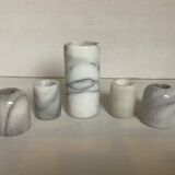 Five marble candlesticks