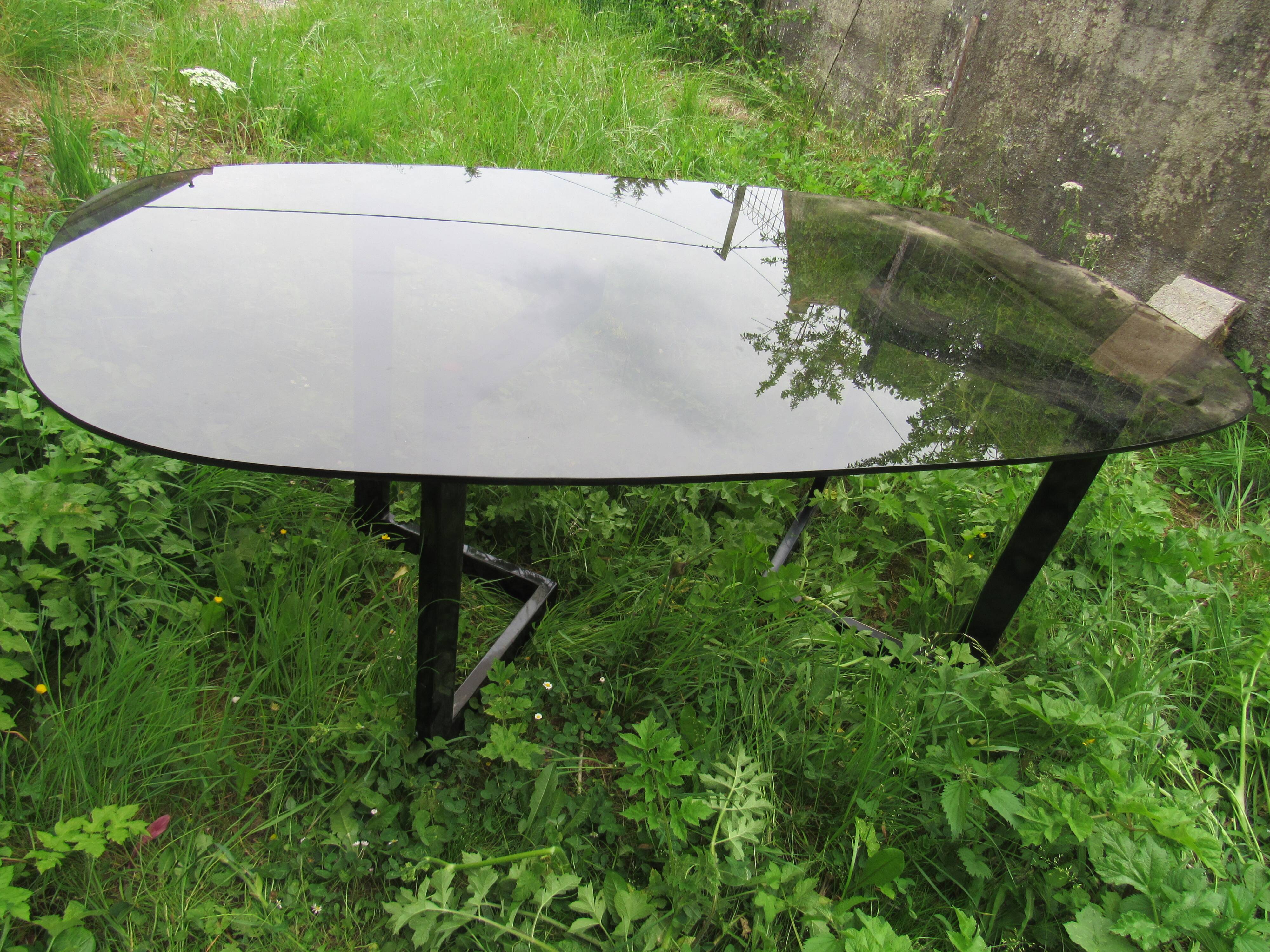 large oval table in smoked glass 80