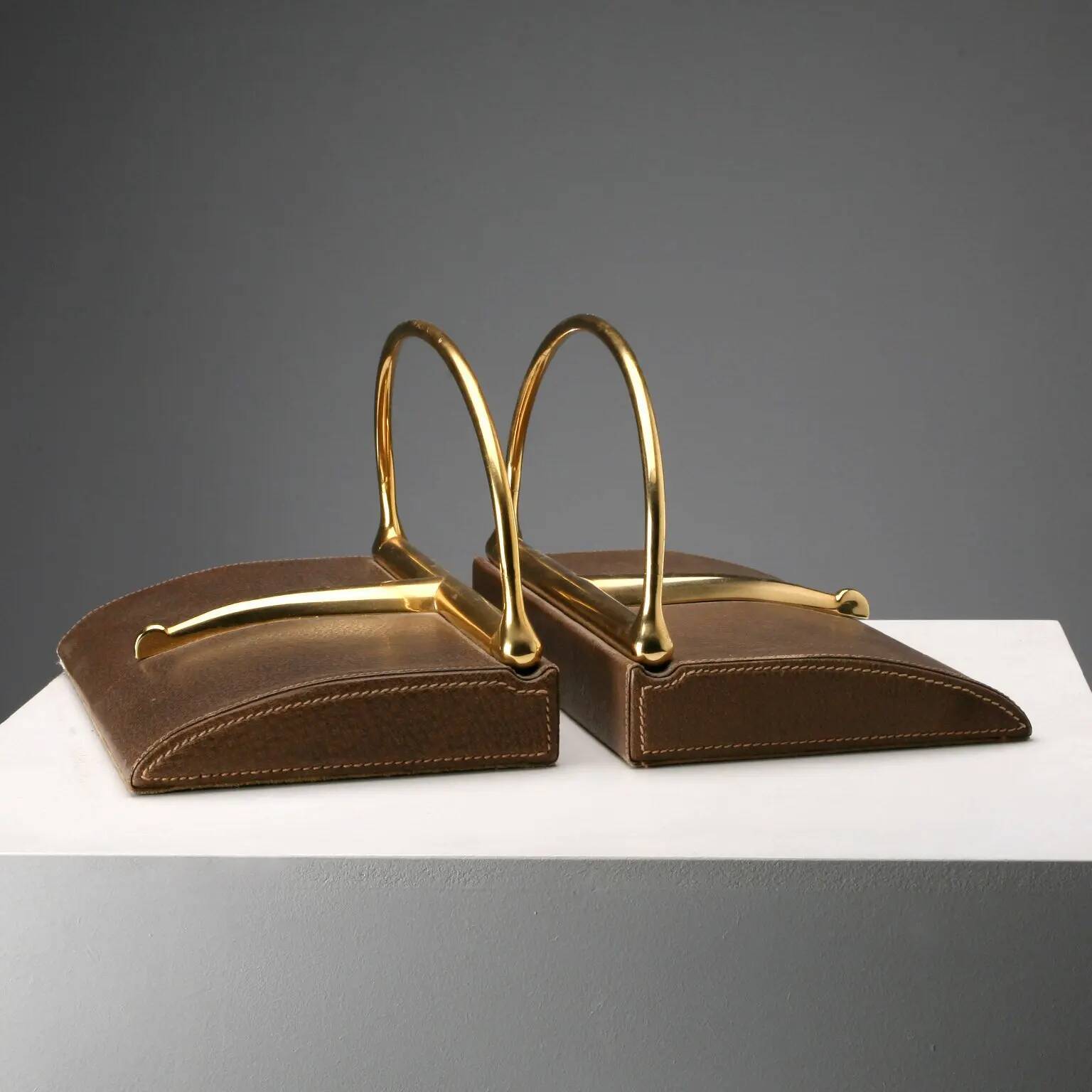 Vintage Gucci bookends in leather and brass, Italy, 1970s.