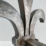 Pair of vintage steel fleur-de-lys andirons