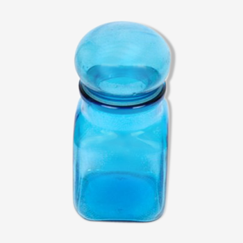 Bottle of pharmacy with screw lid in blue thick glass