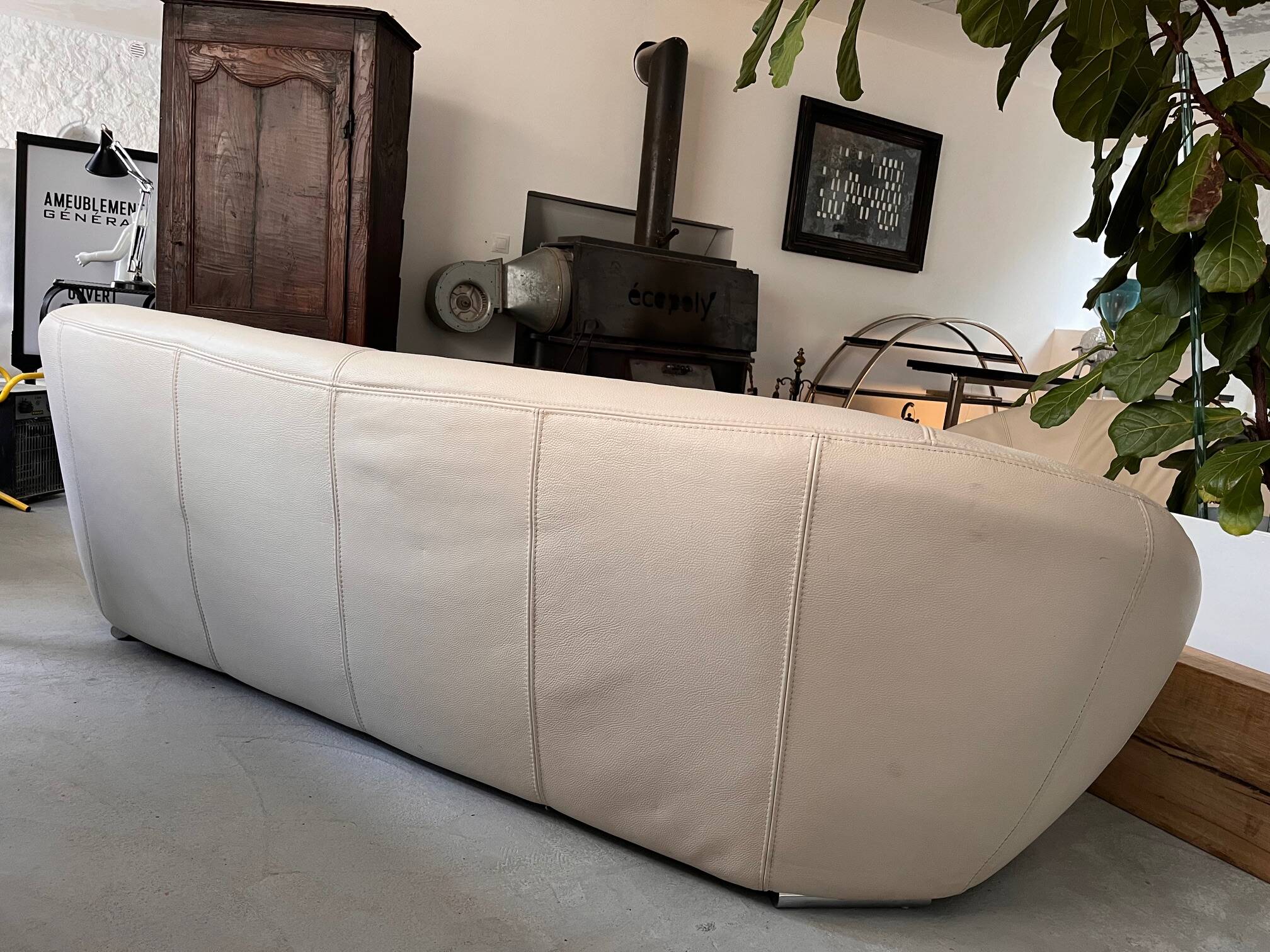 Rounded off-white leather sofa