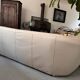 Rounded off-white leather sofa