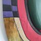 Handcrafted decorative wall mask made of painted wood.