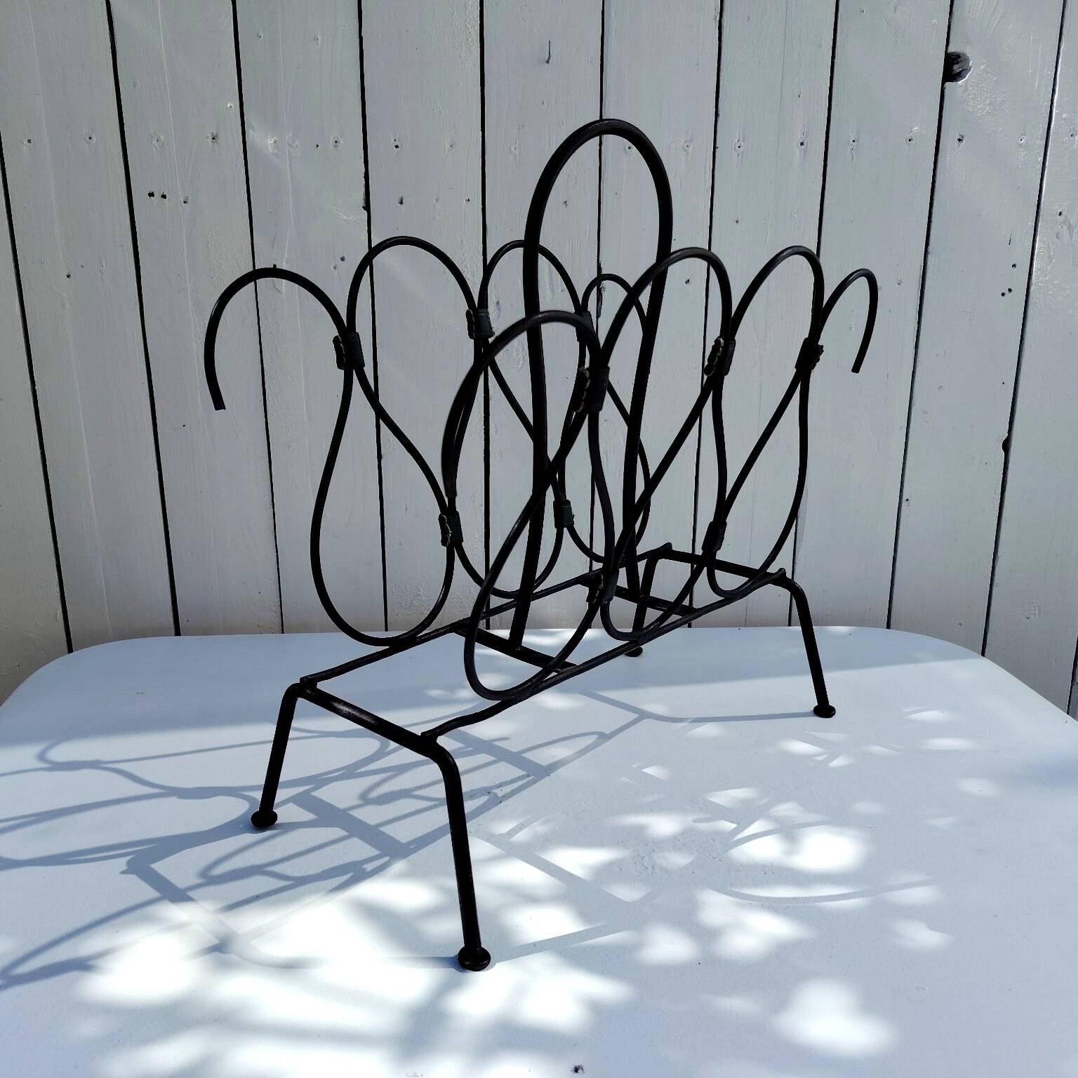 Metal and leather magazine rack, attributed to Jacques Adnet, vintage