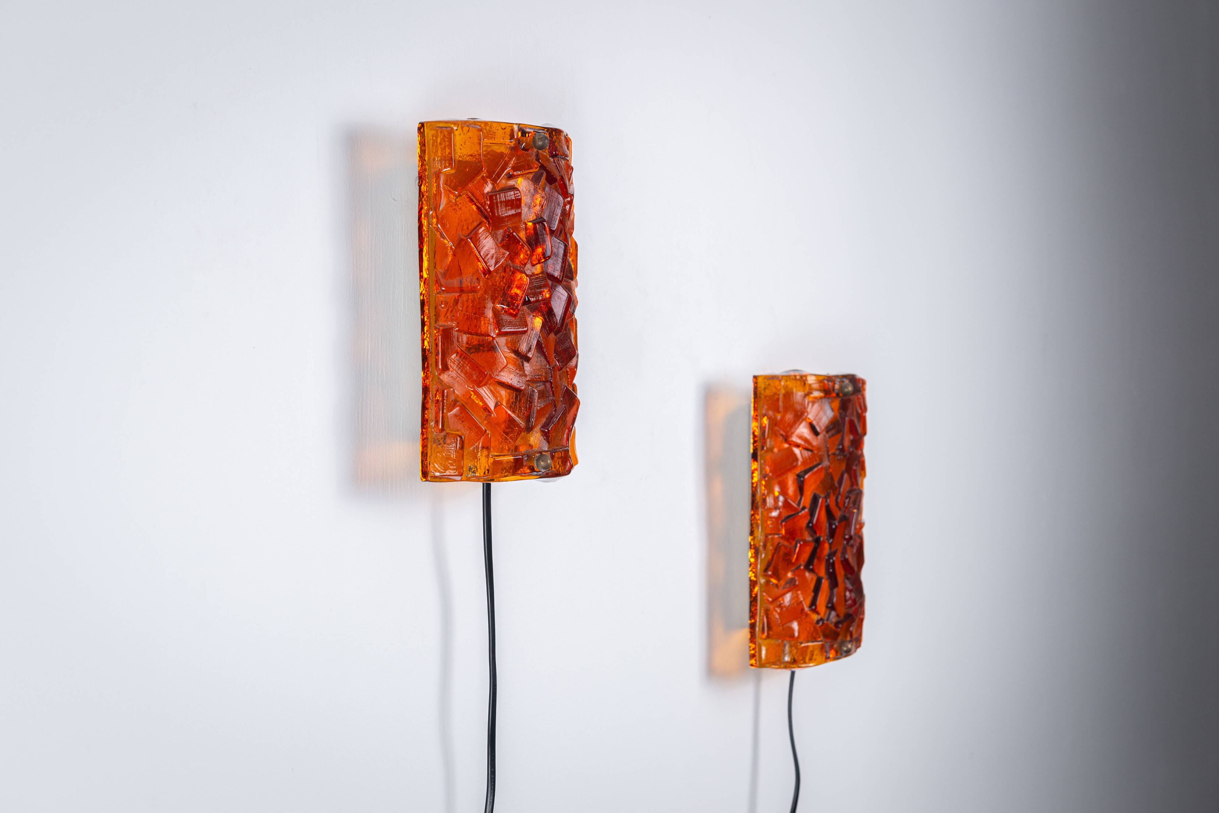 Vitrika Nybro amber coloured wall lamps