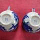 2 tasses en porcelaine avec leur soucoupe, décor "dragon japonais" peint à la main. Faites au Japon.