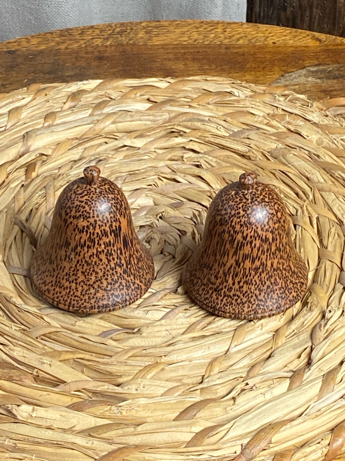 Salt and pepper shakers, bell-shaped, made of wood.