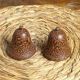 Salt and pepper shakers, bell-shaped, made of wood.