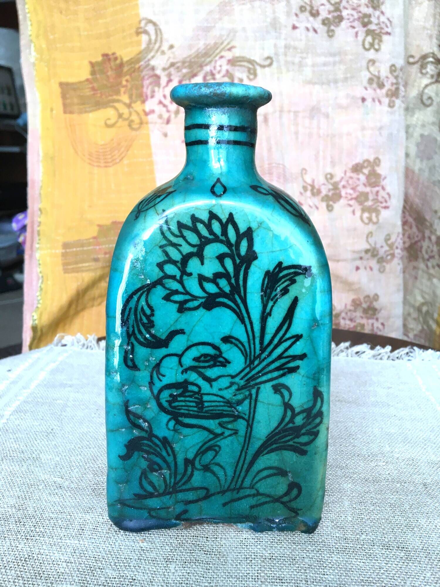 Antique Iranian three-sided blue ceramic bottle
