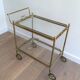 Neoclassical brass trolley with removable trays.