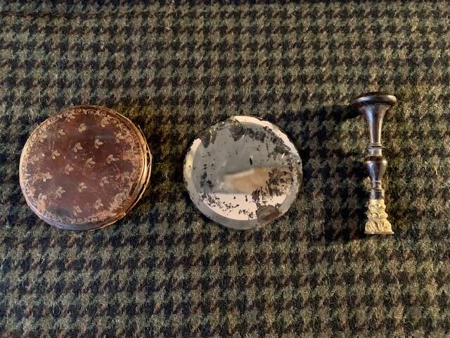Very old round pocket mirror and leather case, 18th century