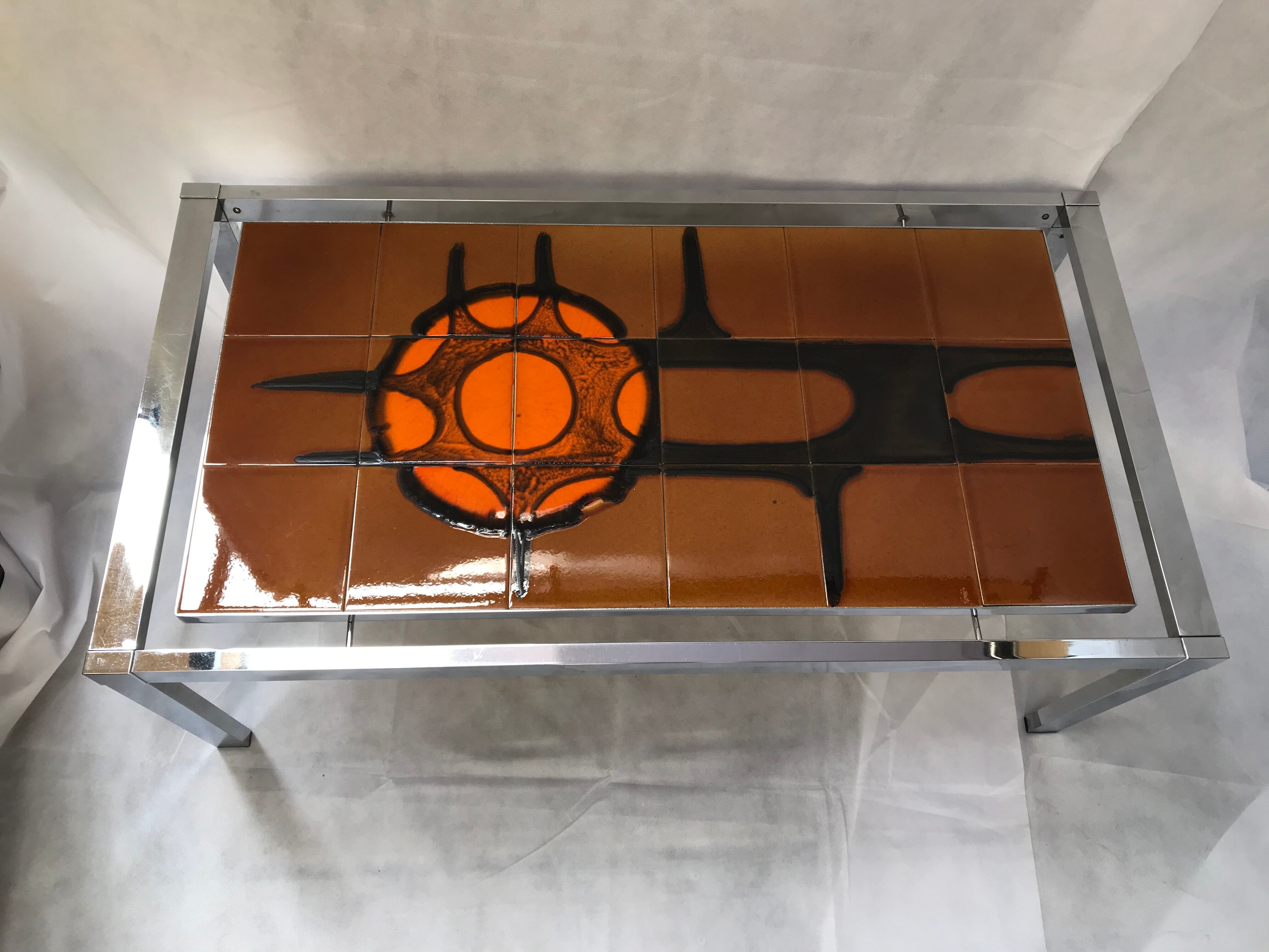 Metal and ceramic earthenware coffee table