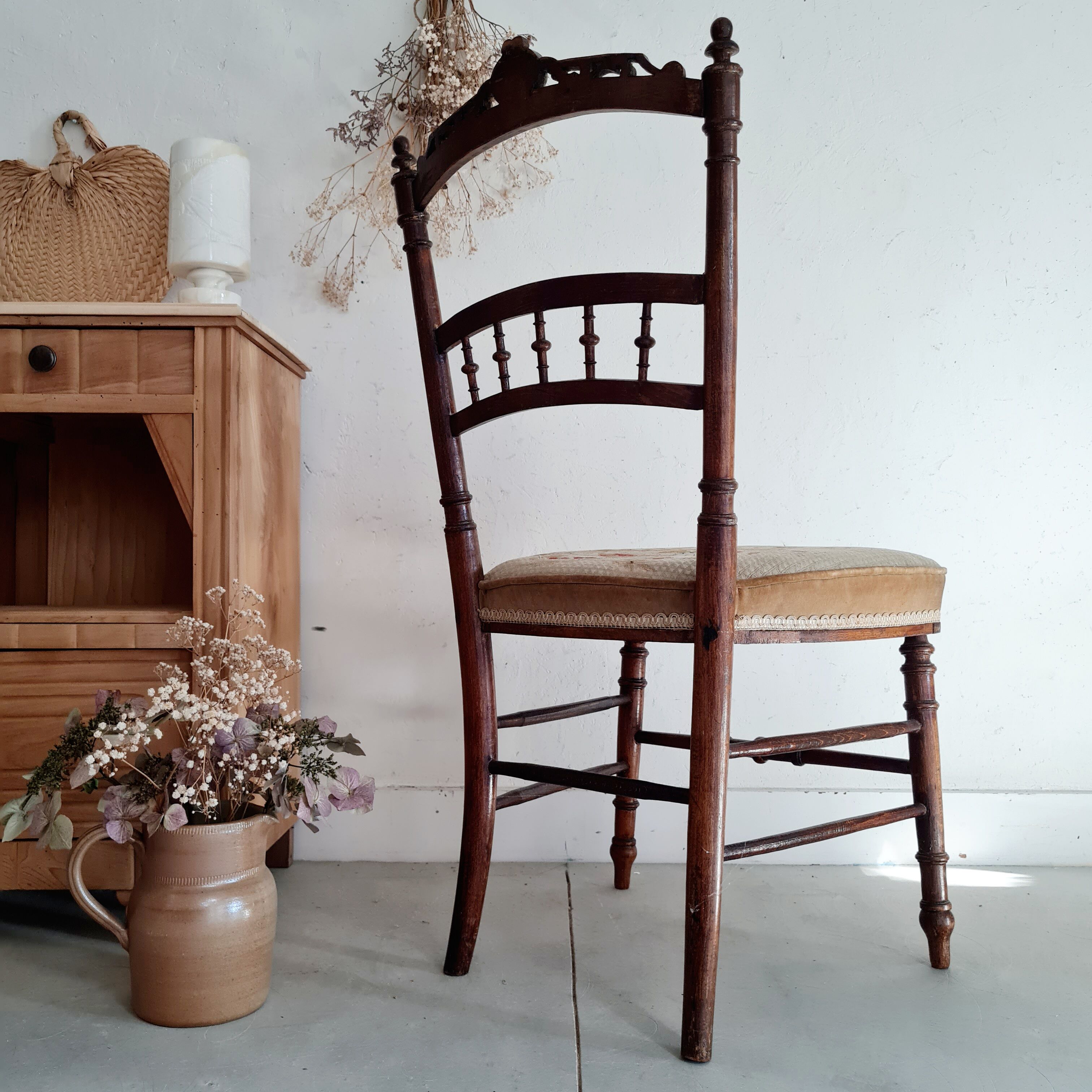 Antique chair turned wood sitting velvet flowers