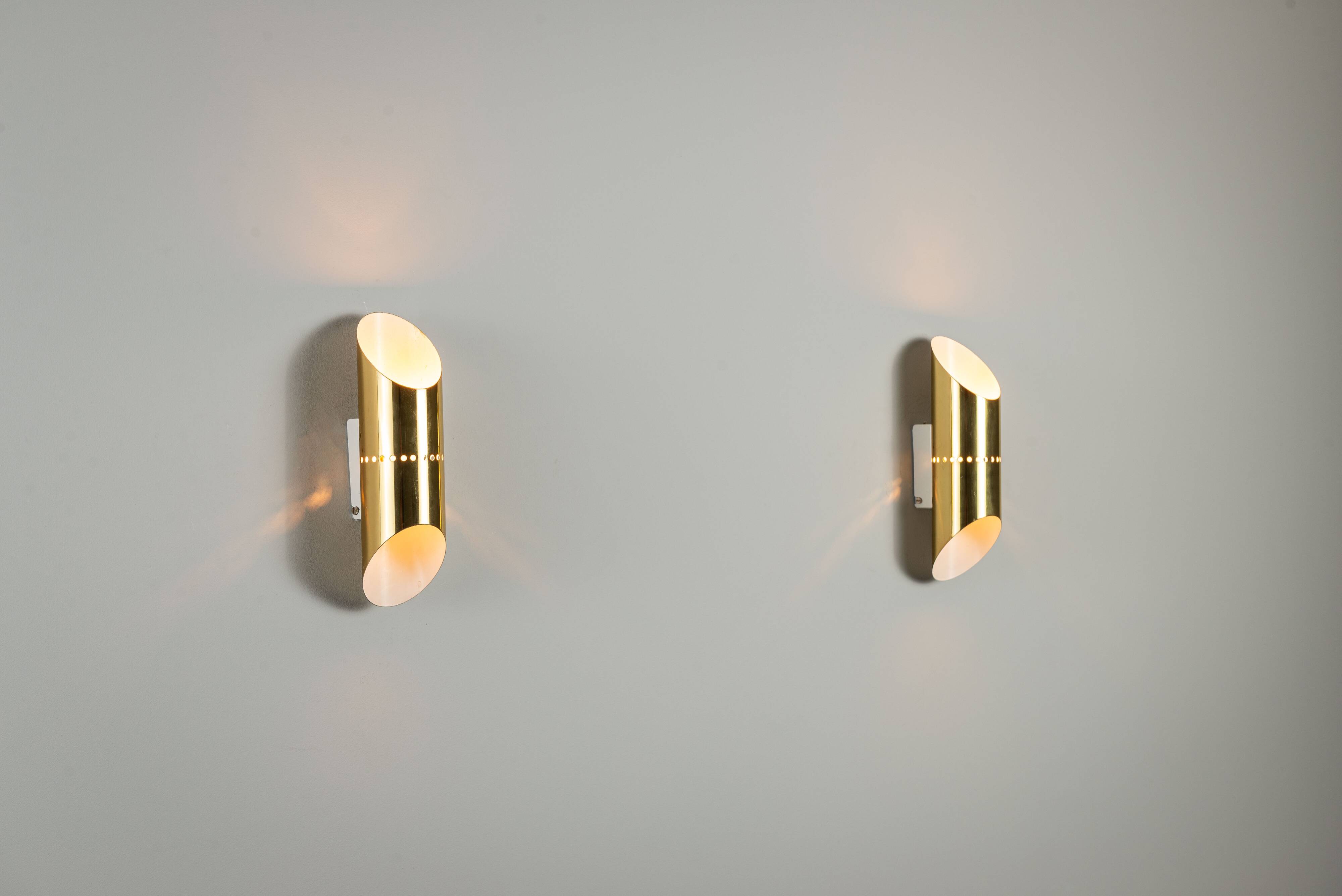 Pair of cylindrical wall lamps in brass with perforated shades