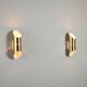 Pair of cylindrical wall lamps in brass with perforated shades