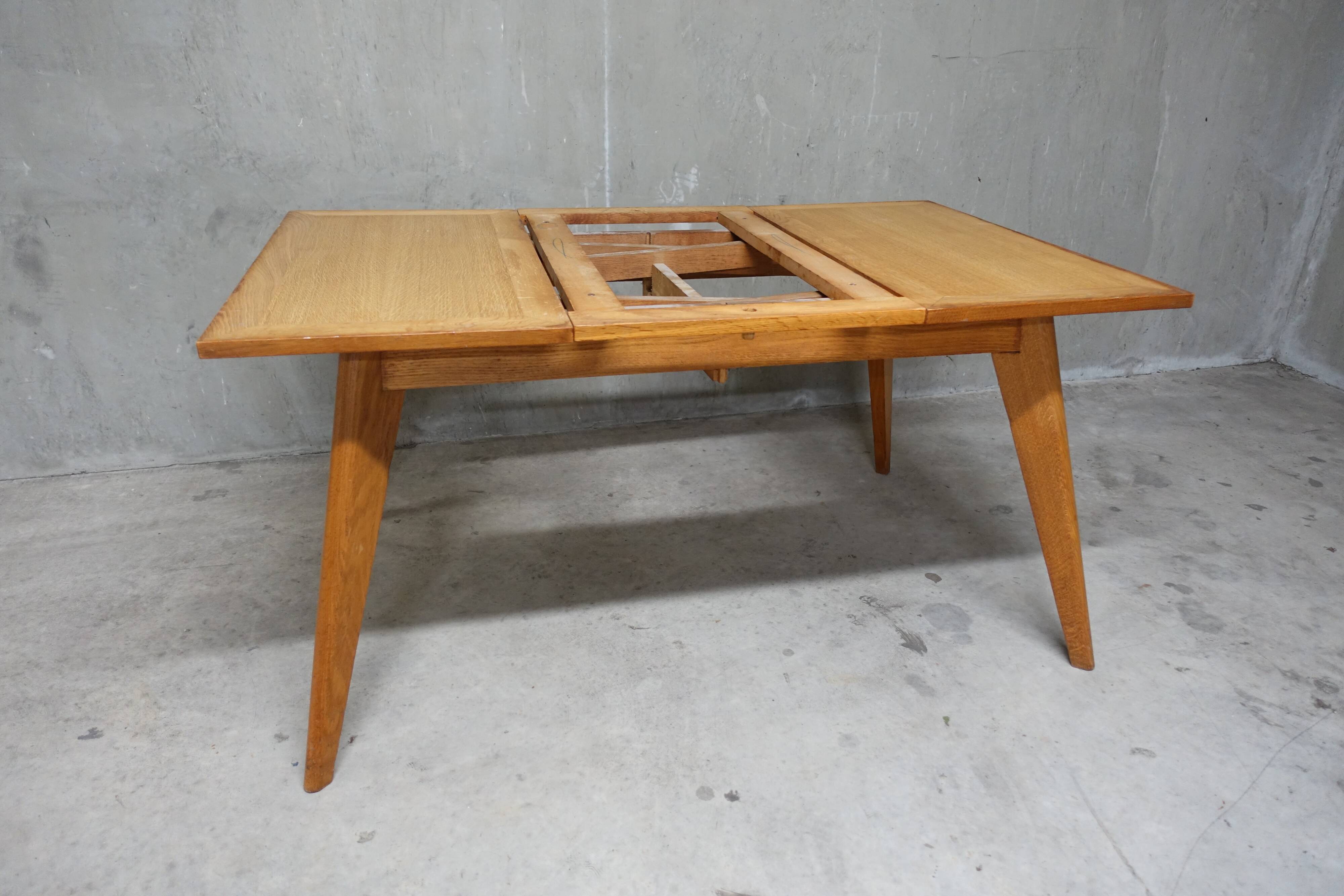 Dining table in blond oak compass feet 1950