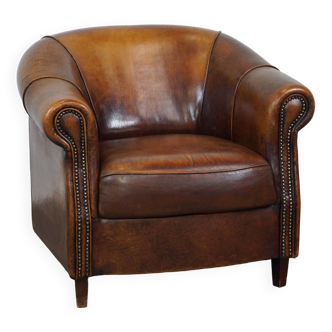 Fauteuil club en cuir de mouton avec de belles couleurs et une assise confortable