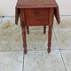 Antique small drop-leaf table from the 19th century.