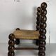 Chaise basse en bois tourné dans le style de Charles Dudouyt, France, années 1950