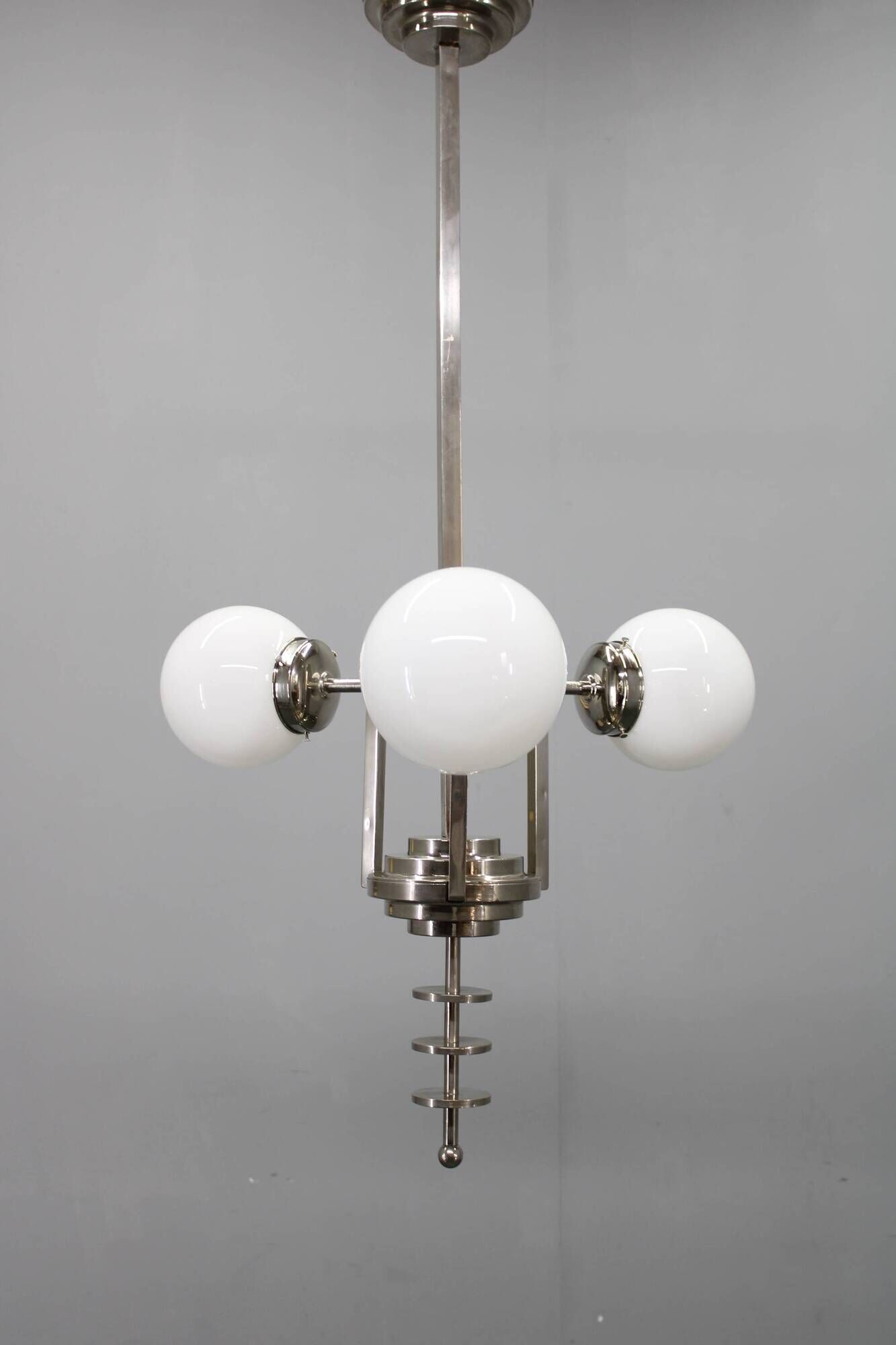 Czechoslovak Art Deco nickel chandelier with three opaline glass globes