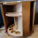 Vintage retractable swivel bar cabinet from the 1950s
