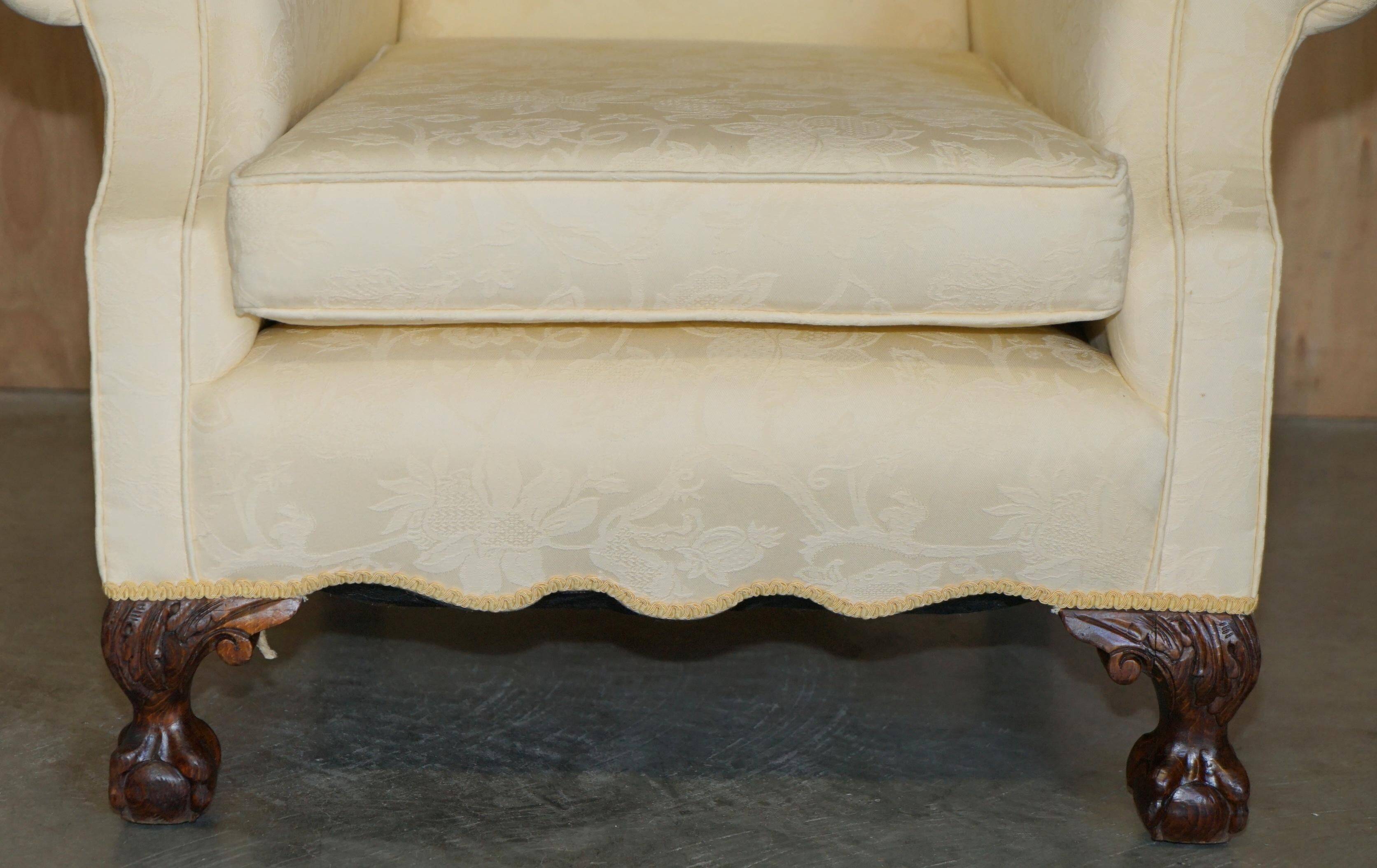 Pair of Edwardian armchairs from 1910 with carved legs and fabric.