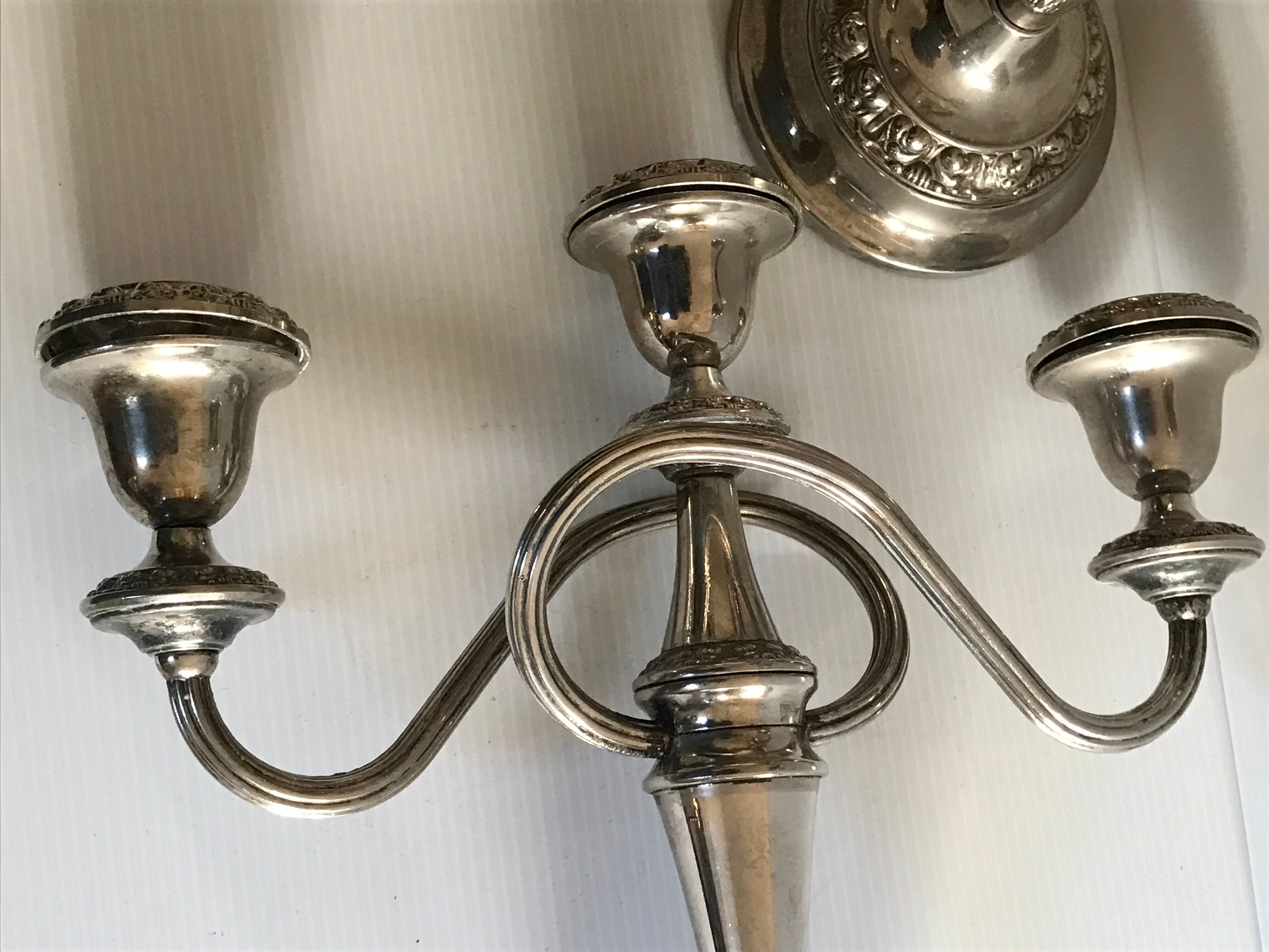 Pair of silver metal chandeliers