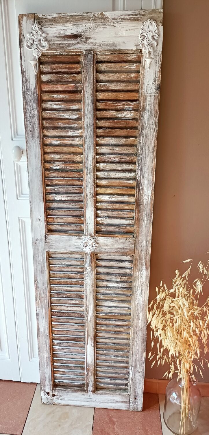 Vintage shutter renovated into a coat rack