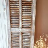 Vintage shutter renovated into a coat rack