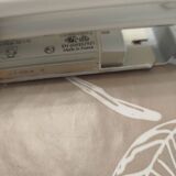 Pair of Art Deco wall sconces in plaster and pressed glass.