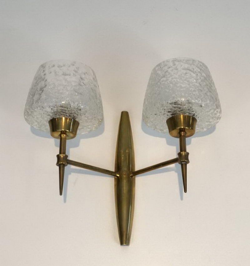 Pair of bronze sconces with worked glass reflectors
