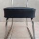 Vintage office chair in chrome metal and faux leather.