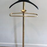 Neoclassical style valet stand in brass and black lacquered wood. French work. Circa 1940