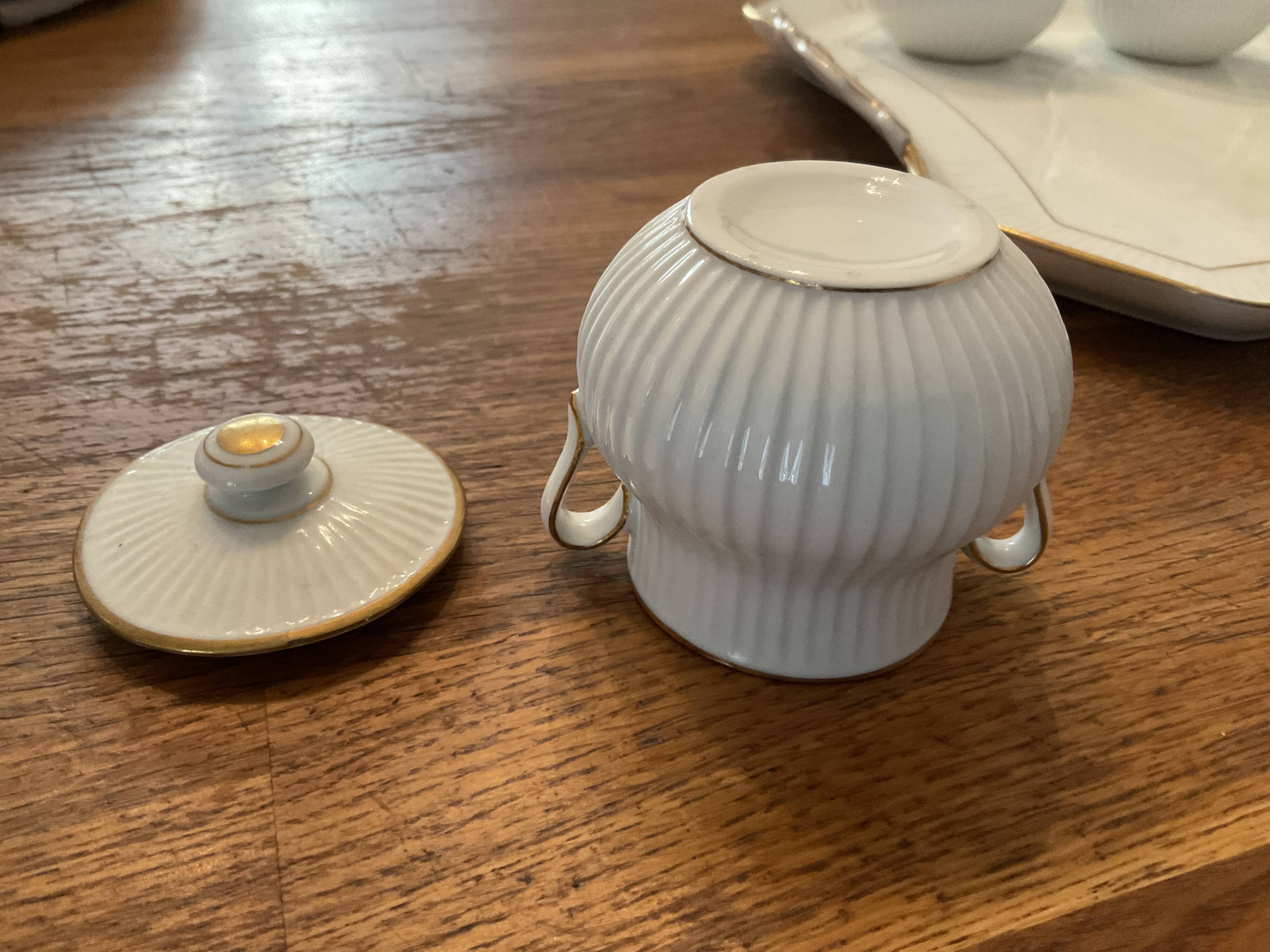 Porcelain tray and 8 matching cream pots. Antique