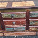 Furniture low in colorful wood. 12 drawers and 1 door