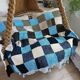 Hand knitted patchwork plaid