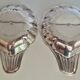 Silver-plated shell-shaped butter dishes, in the shape of a scallop shell.