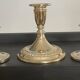 Series of 3 vintage candle holders in silver metal 70s