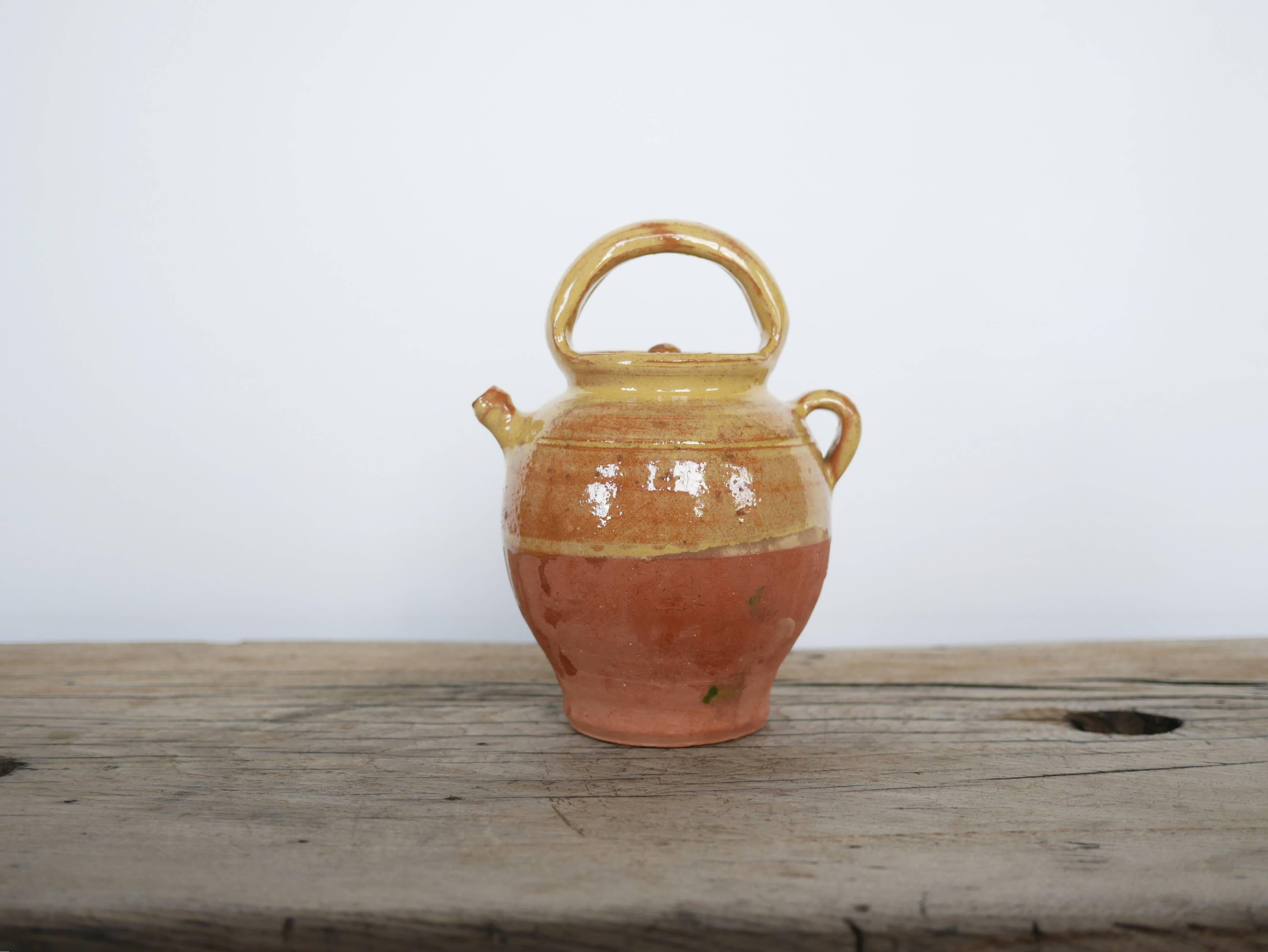 Old gargoulette pot in glazed terracotta