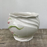 White ceramic pot cache in old flower slip