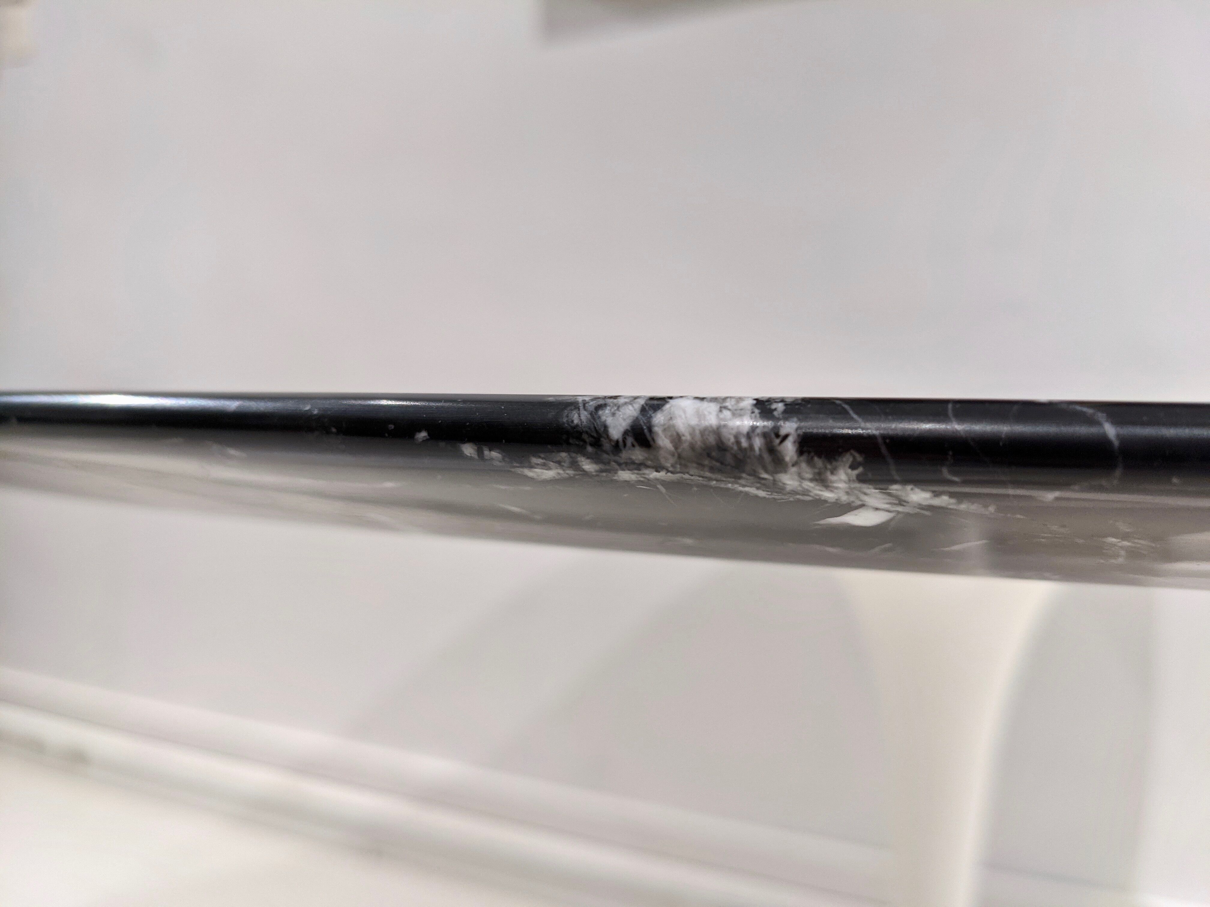 Tulip table white base and black marble marked by Saarinen edition knoll international