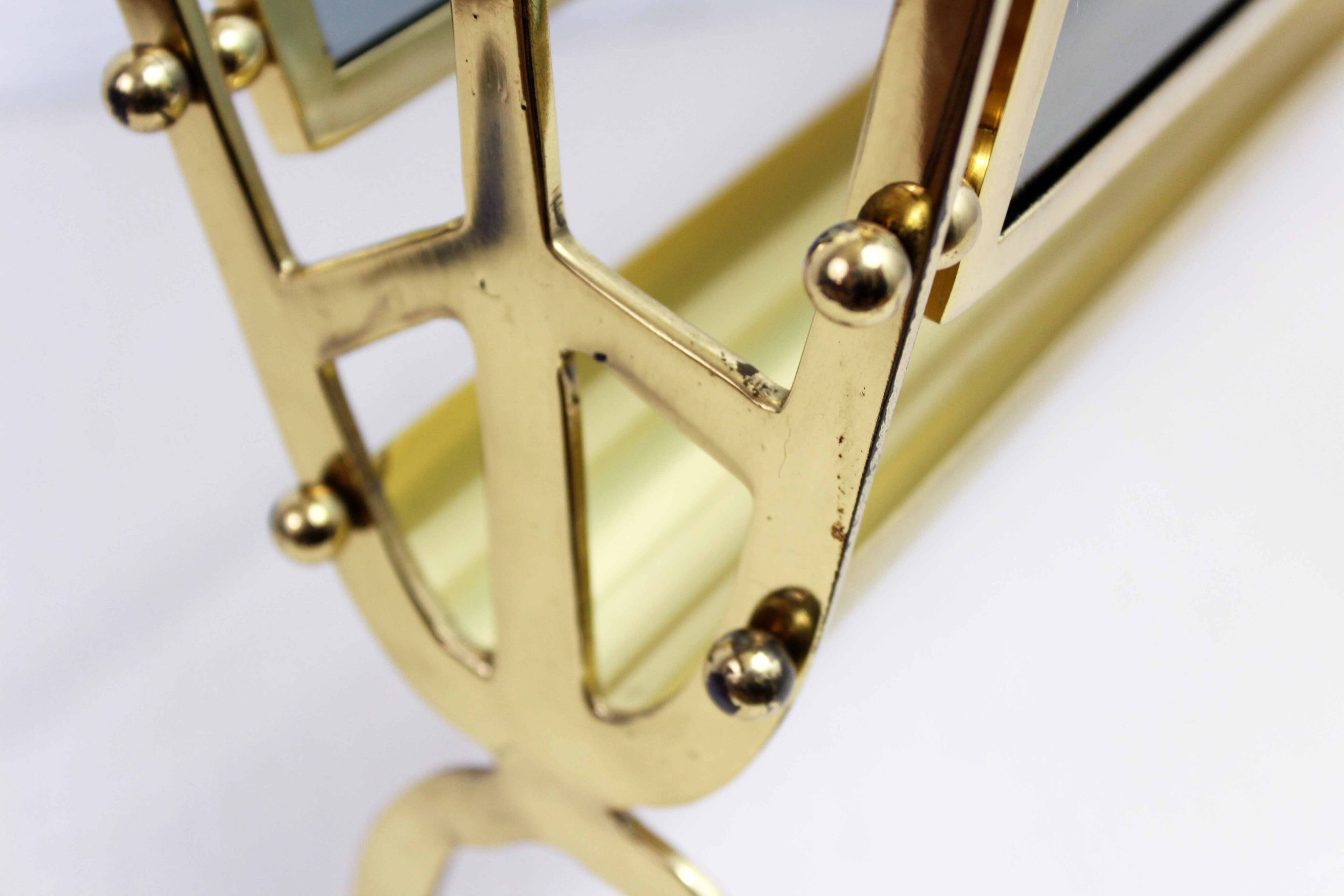 Glass and brass magazine rack, 1970