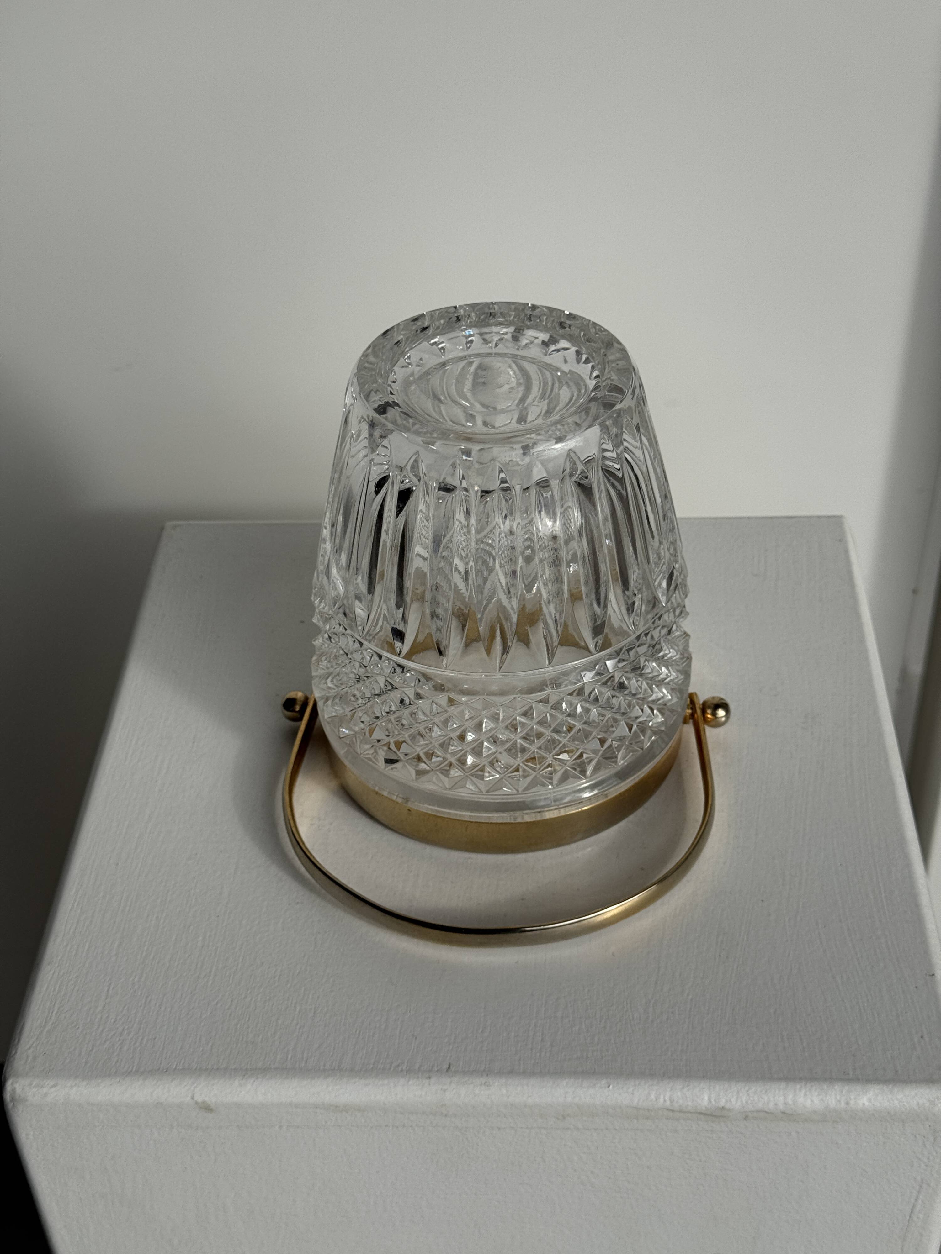 Small golden glass ice bucket with diamond point design and its scoop.