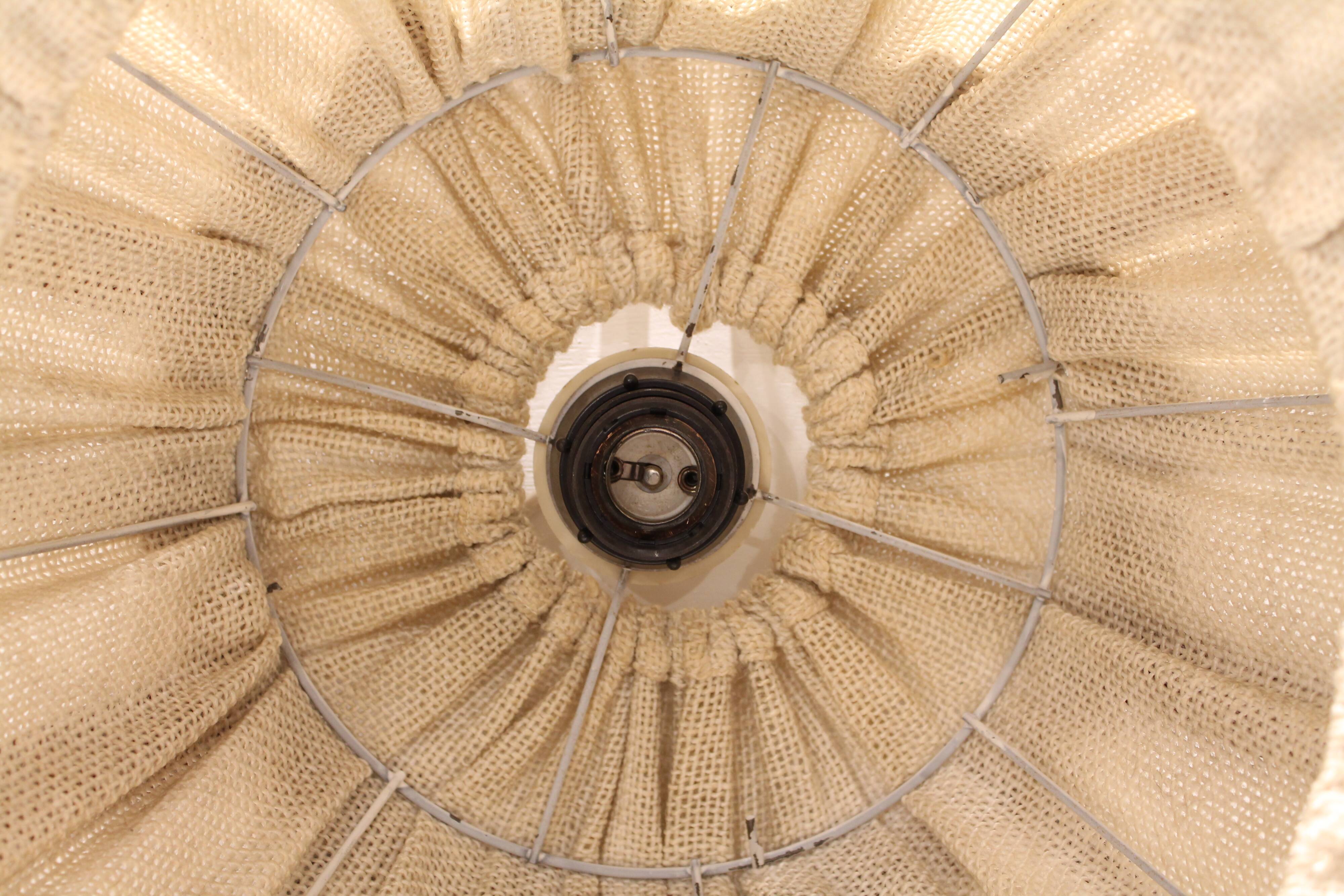 Suspension in teak and textile.