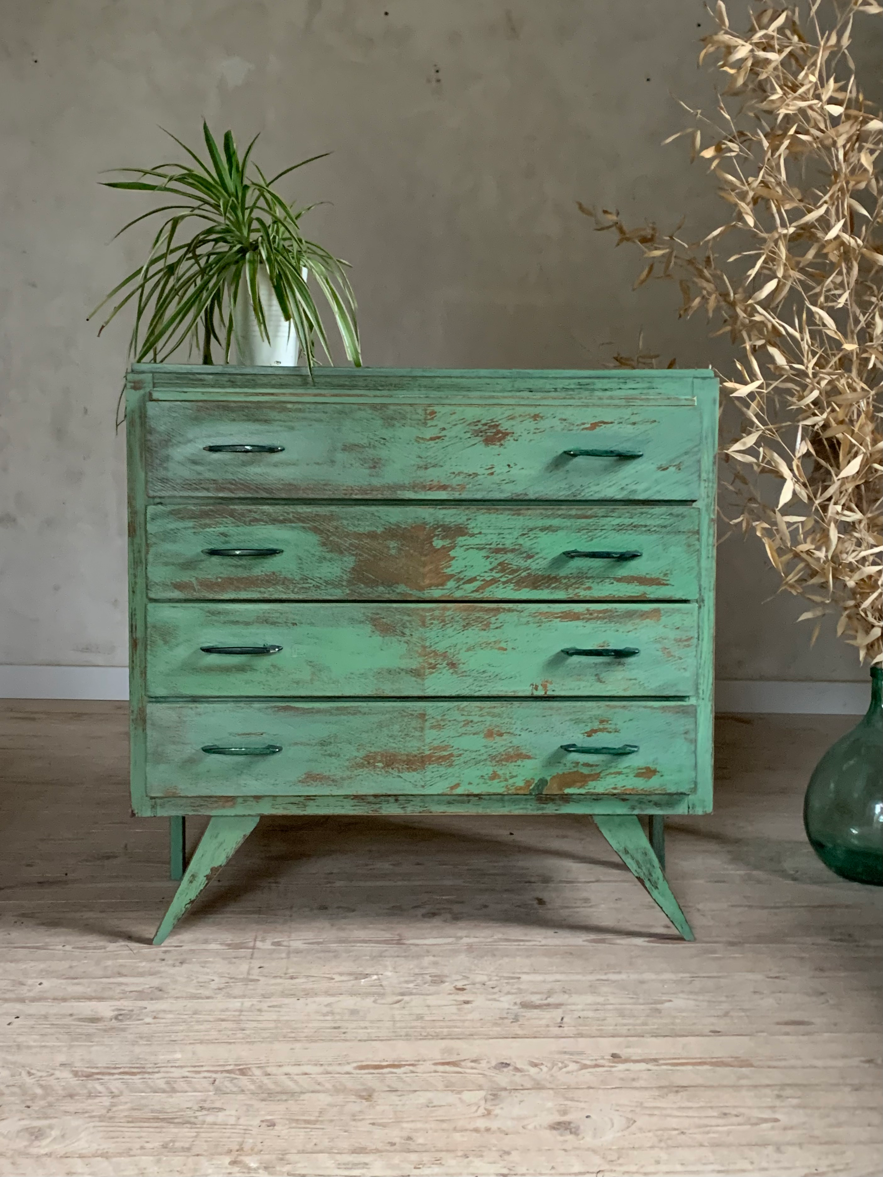 Vintage compass leg commode with a patina.