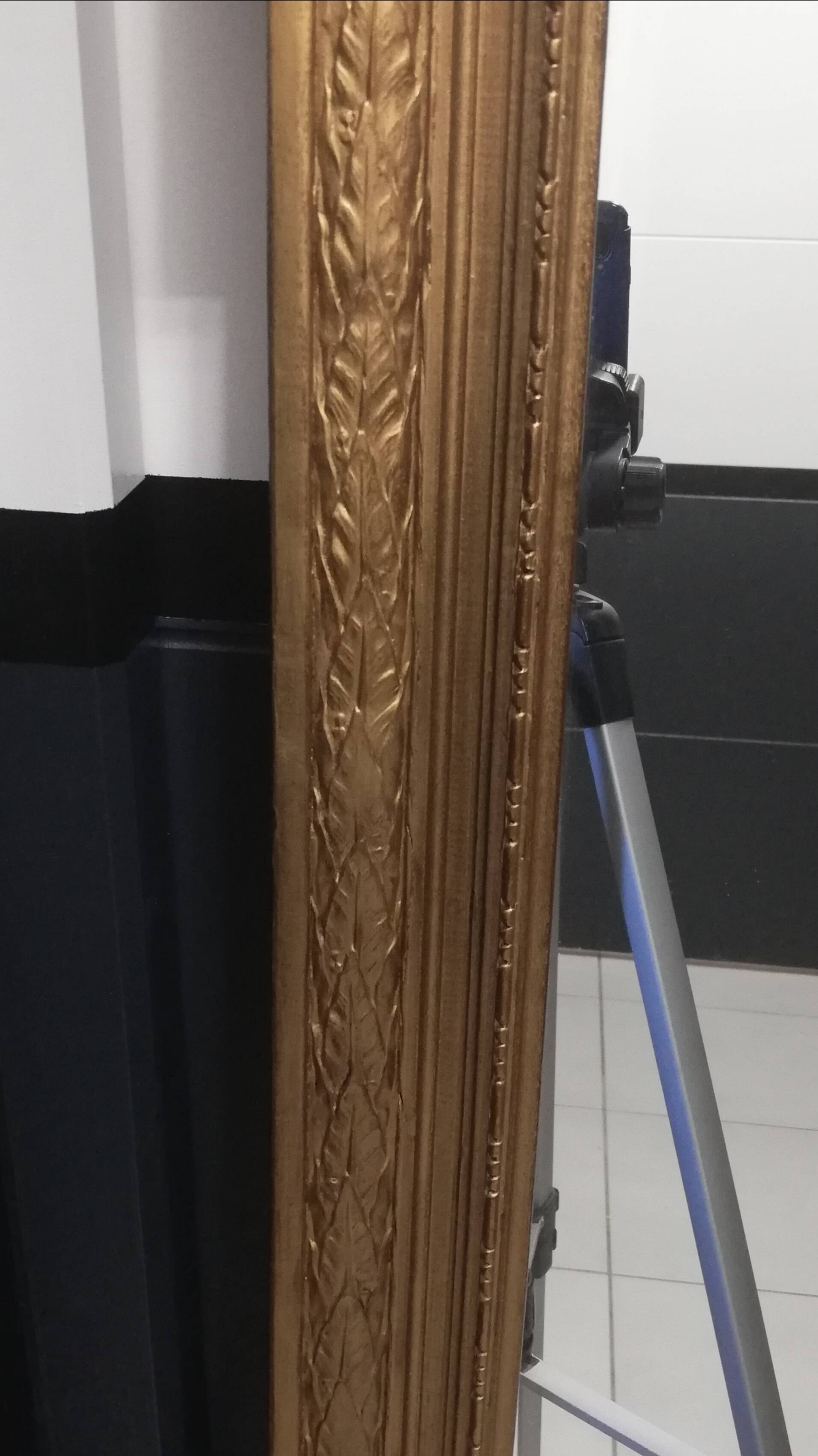 Carved wooden pediment mirror