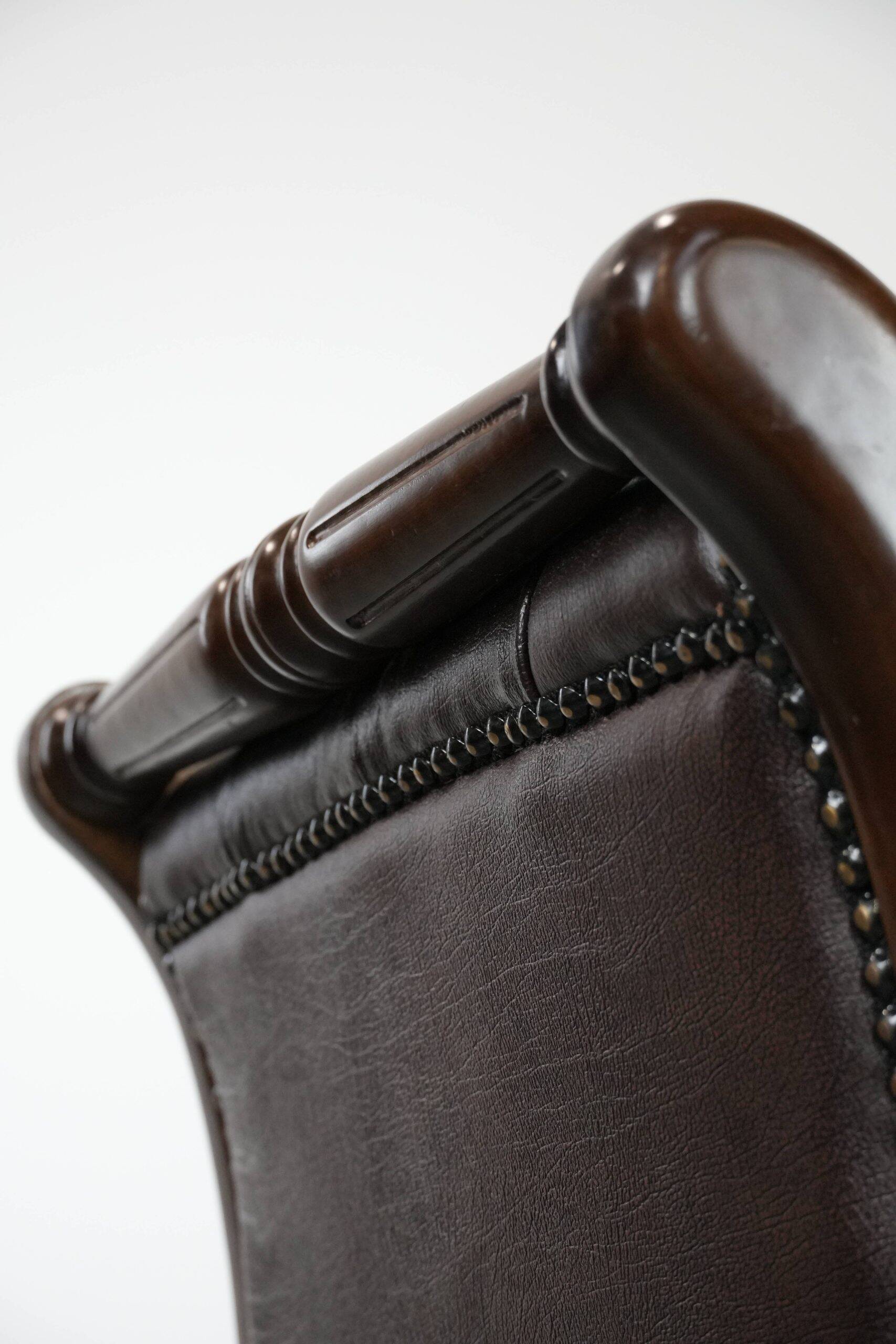 Chesterfield office chair in English style made of cow leather and wood.