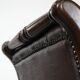 Chesterfield office chair in English style made of cow leather and wood.