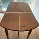 Round mahogany folding and extendable table